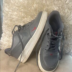 Nike Gray and Red Sneakers with Classic Silhouette